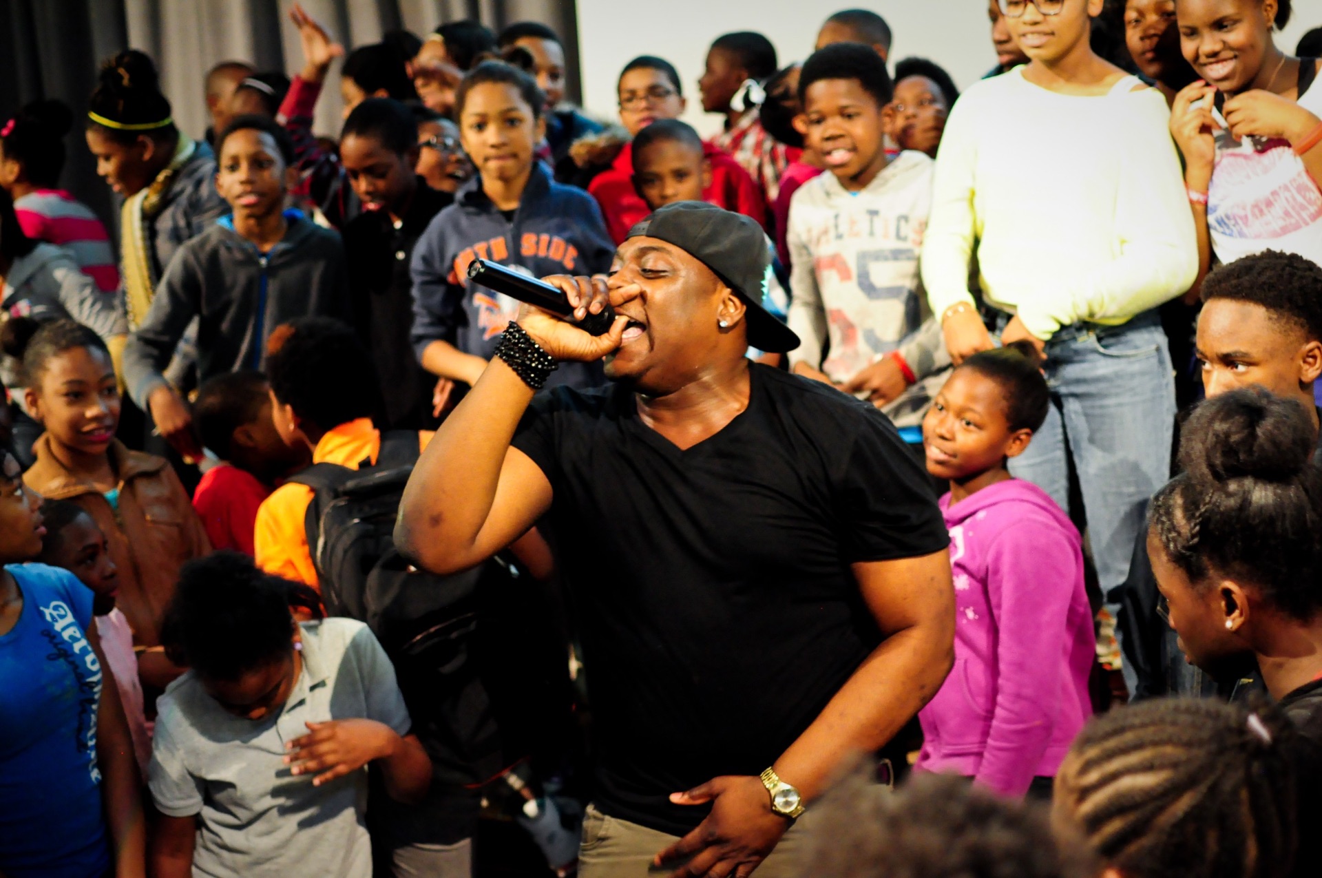 Performer in the middle of an audience of kids