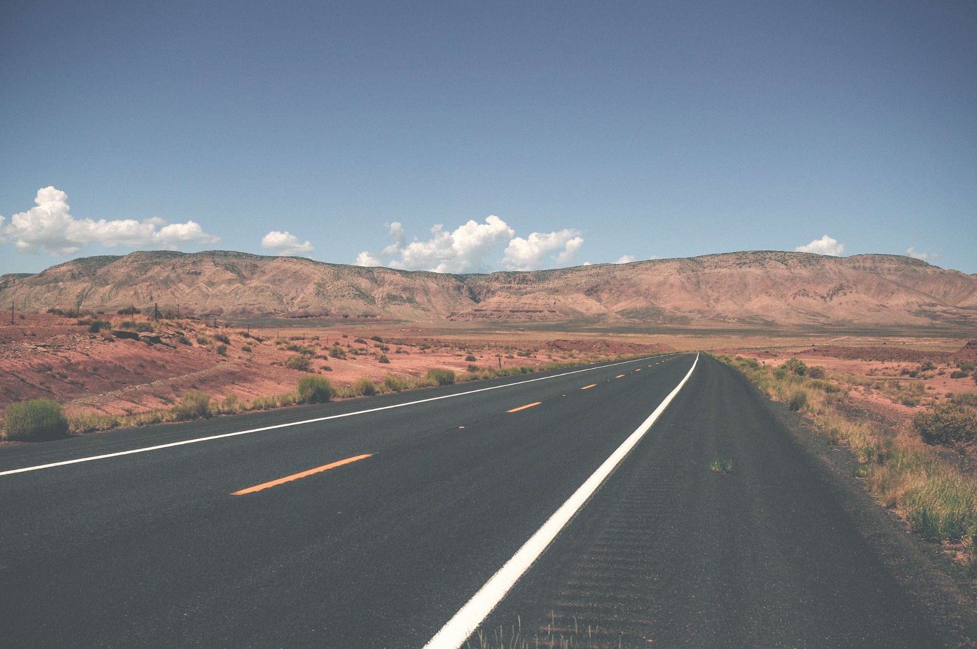 Open desert road under wide sky